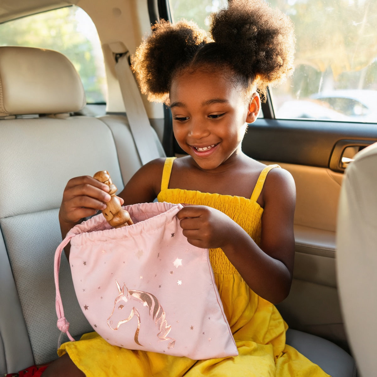 Child using JoyBundle canvas pouch as everyday treasure bag