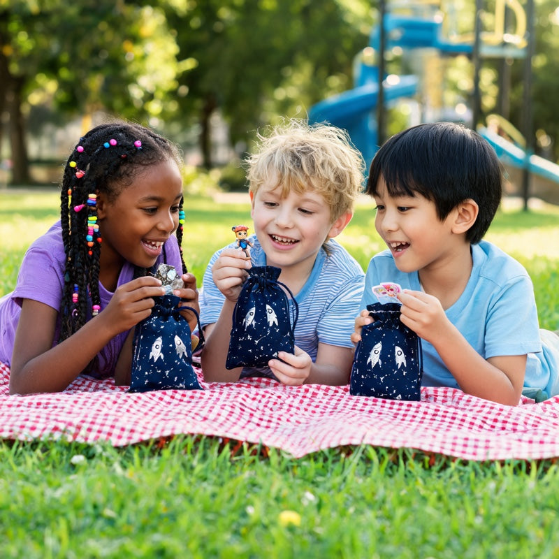 Diverse group of kids showing Galaxy Adventure bundles at park party